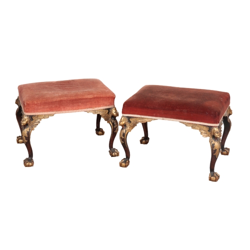 486 - A PAIR OF GEORGE II STYLE MAHOGANY AND PARCEL GILT STOOLS 19th century, the rectangular tops with re... 