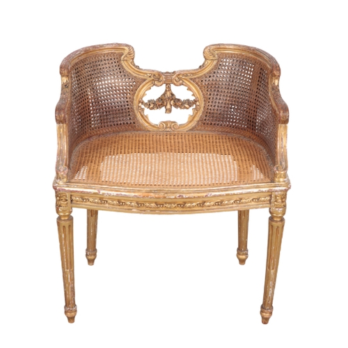 489 - A REGENCY GILTWOOD DRESSING CHAIR 19th century, with shaped and moulded cresting rail over a caned b... 