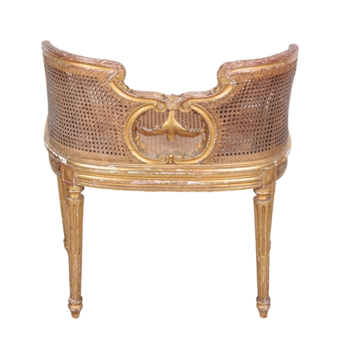 489 - A REGENCY GILTWOOD DRESSING CHAIR 19th century, with shaped and moulded cresting rail over a caned b... 