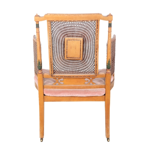 497 - AN EDWARDIAN PAINTED ARMCHAIR early 20th century, the caned back with a central panel depicting a re... 