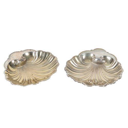 50 - A PAIR OF AMERICAN STERLING SILVER SCALLOP SHAPE BUTTER DISHES by Gorham, with gilded bowls, each 12... 