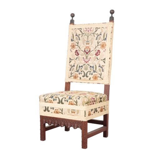 501 - A PAIR OF CHARLES II STYLE MAHOGANY HALL CHAIRS with foliate pattern covers, the square backs with t... 