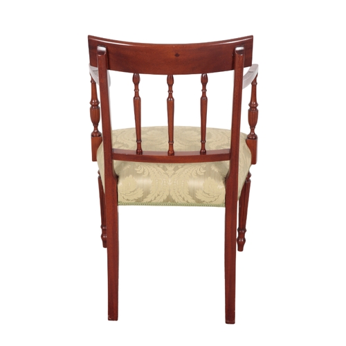 515 - A GEORGE III STYLE MAHOGANY ARMCHAIR with damask covers, on turned front legs, 88cm high x 55cm wide