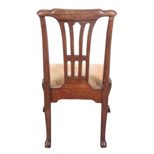 526 - A GEORGE II WALNUT SIDE CHAIR 18th century, the carved cresting rail over a pierced back, with drop ... 