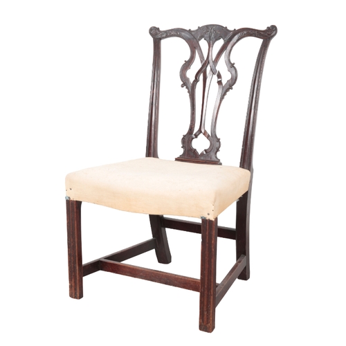 527 - A GEORGE III MAHOGANY DINING CHAIR the shaped and carved cresting rail over a pierced vase pattern b... 