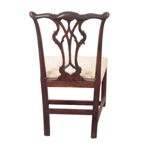 527 - A GEORGE III MAHOGANY DINING CHAIR the shaped and carved cresting rail over a pierced vase pattern b... 