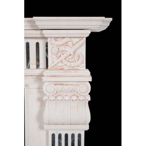 531 - A GEORGE III STYLE WHITE MARBLE CHIMNEY PIECE the inverted breakfront mantel over a frieze centred b... 