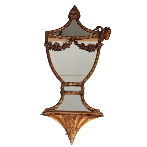 552 - A PAIR OF REGENCY STYLE GILTWOOD AND COMPOSITION URN SHAPED MIRRORS with flaming torch and ram's hea... 