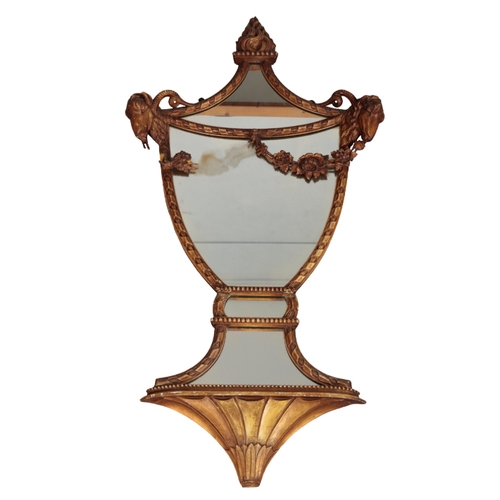 552 - A PAIR OF REGENCY STYLE GILTWOOD AND COMPOSITION URN SHAPED MIRRORS with flaming torch and ram's hea... 