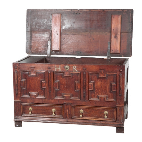 558 - AN EARLY 18TH CENTURY PANELLED OAK MULE CHEST the moulded front with studded initials 'HR', two draw... 