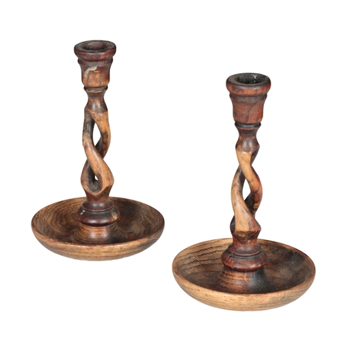 559 - A COLLECTION OF TREEN including a chequers board, two barley twist candlesticks, 21cm high, a pricke... 