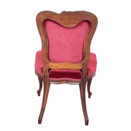 562 - A SET OF FIVE VICTORIAN ROSEWOOD DINING CHAIRS of French design, with solid rosewood frames, sinuous... 