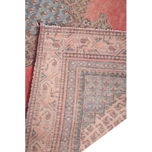 572 - A SERABEND CARPET 20th Century, woven in blue, fawn and pink with oval double headed medallion and s... 