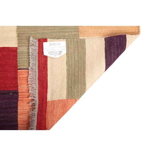 576 - A CONTEMPORARY KILIM RUNNER woven in colours with an abstract design, 301cm x 81cm