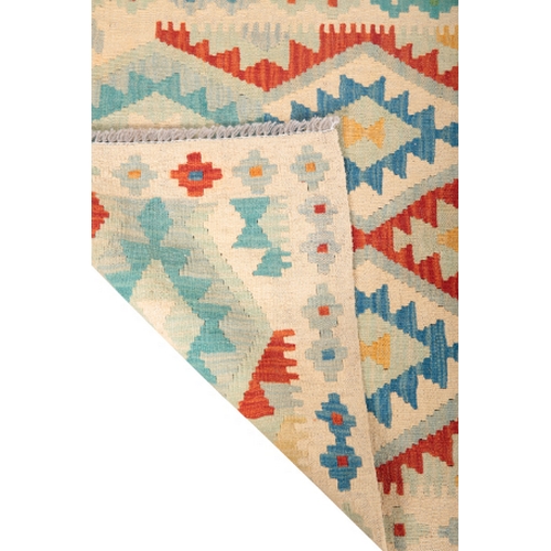 582 - A CONTEMPORARY ANATOLIAN STYLE KILIM RUNNER woven in colours with endless twin lozenge pole medallio... 