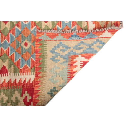 583 - A CONTEMPORARY ANATOLIAN STYLE KILIM RUG woven in pale blue and other colours with four linked geome... 