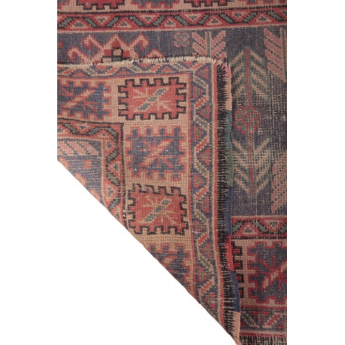 593 - AN ANTIQUE TURKISH LONG RUG woven in muted colours with three hooked lozenge medallions, on a blue g... 