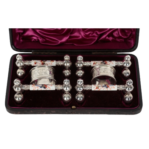 66 - A VICTORIAN DINING TABLE ACCESSORY SET comprising a set of four silver plated and Imari palette cera... 