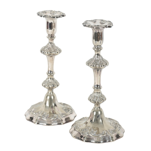 68 - A PAIR OF LATE 19TH CENTURY SILVER PLATED PILLAR CANDLESTICKS with leaf mouldings, double knopped st... 