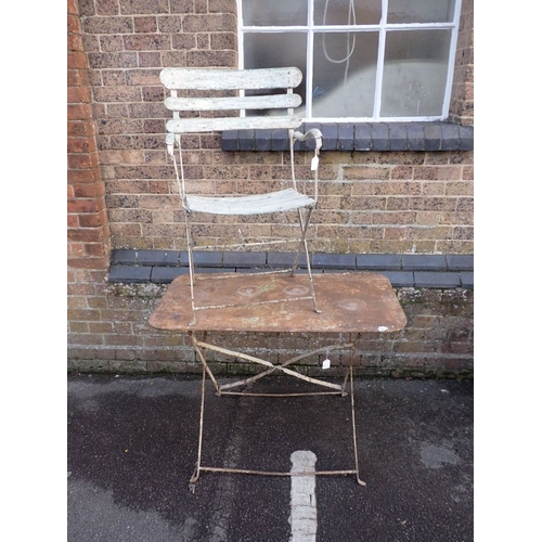 19 - AN IRON GARDEN TABLE, AND SIMILAR ARMCHAIR 100 x 60cm (rusted top, chair slat broken) (2). Provenanc... 
