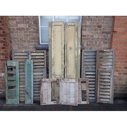 22 - A COLLECTION OF WINDOW SHUTTERS including two English type with fielded panels, and Continental louv... 