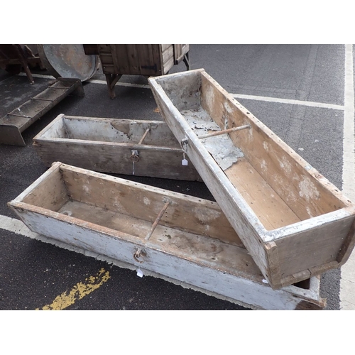 31 - THREE PAINTED AND METAL MOUNTED TROUGHS each measuring c.32cm high x 164cm wide x 42cm deep (3)
