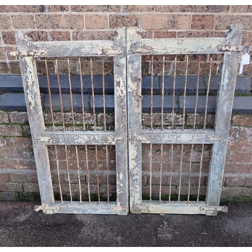 4 - A PAIR OF WOOD AND IRON GATES 19th century, each gate 50cm wide 106cm high. Provenance: The Richard ... 