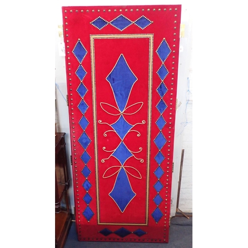 7 - A SUBSTANTIAL PAIR OF DOORS, COVERED WITH BLUE AND RED VELVET and with decorative braiding and brass... 