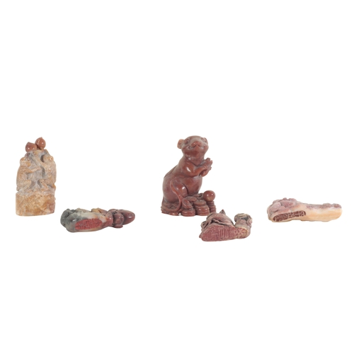 16 - A COLLECTION OF THIRTEEN CHINESE CARVED FIGURES largely soapstone, including a carved and pierced gr... 