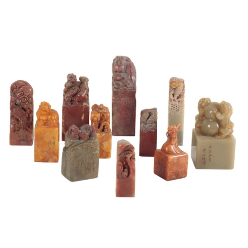17 - A GROUP OF ELEVEN CHINESE SOAPSTONE SEALS each carved with animal or mythical beast finials, the tal... 