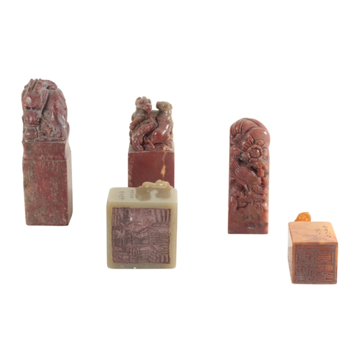 17 - A GROUP OF ELEVEN CHINESE SOAPSTONE SEALS each carved with animal or mythical beast finials, the tal... 
