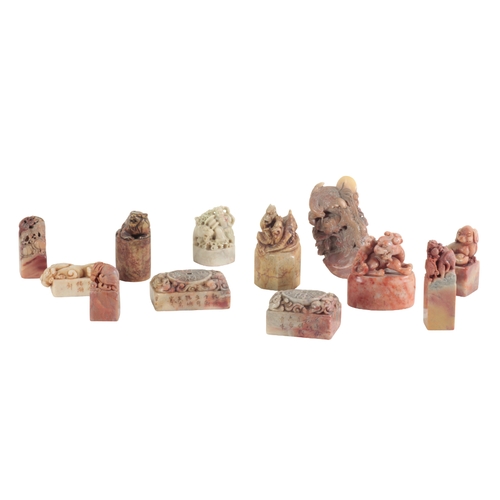 18 - A COLLECTION OF TWELVE CHINESE SOAPSTONE SEALS predominantly carved with animal and mythical beast f... 