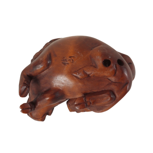 73 - TWO JAPANESE CARVED WOOD NETSUKE one example, in the form of a starving wolf, signed to the base, me... 