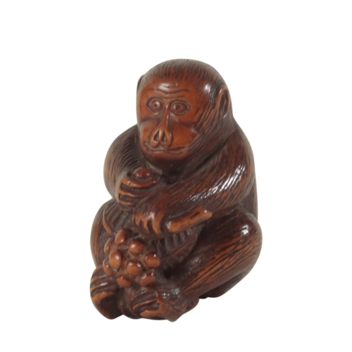 77 - A GROUP OF THREE JAPANESE CARVED WOOD NETSUKE, ONE SIGNED BY YOSHINOBU Edo period, two examples of m... 