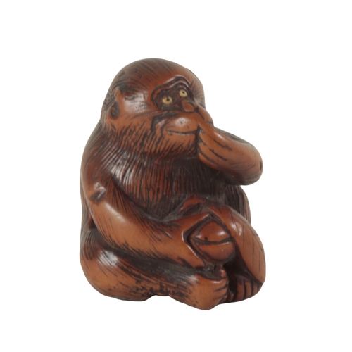 77 - A GROUP OF THREE JAPANESE CARVED WOOD NETSUKE, ONE SIGNED BY YOSHINOBU Edo period, two examples of m... 