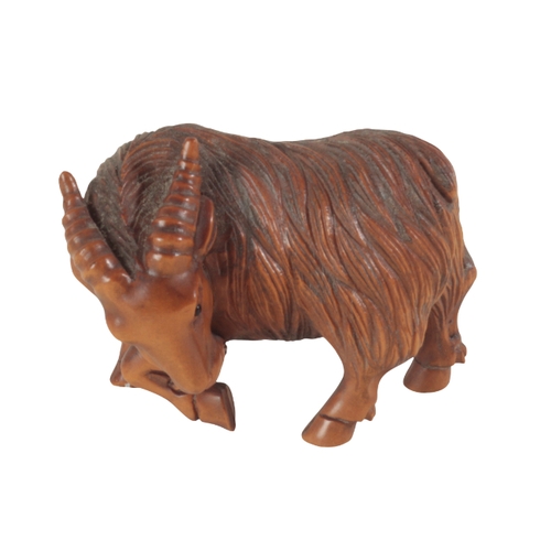 83 - TWO JAPANESE CARVED WOOD NETSUKE one example modelled as a goat, signed to the base of a foot, 4cm h... 