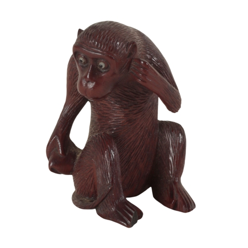 87 - A GROUP OF THREE CARVED WOOD NETSUKE including a Meiji period figured monkey, with inlaid eyes, 5cm ... 