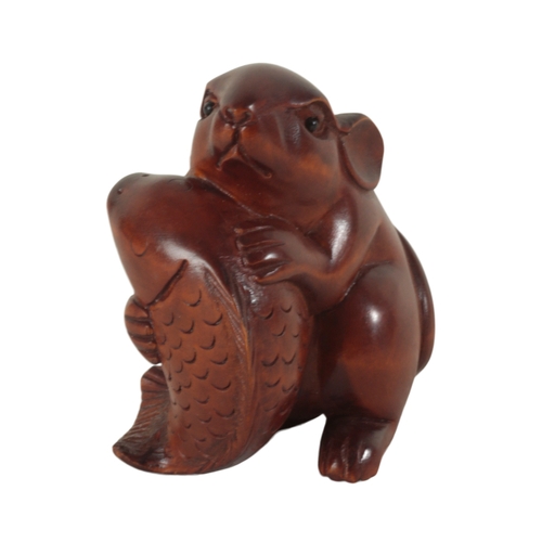 87 - A GROUP OF THREE CARVED WOOD NETSUKE including a Meiji period figured monkey, with inlaid eyes, 5cm ... 