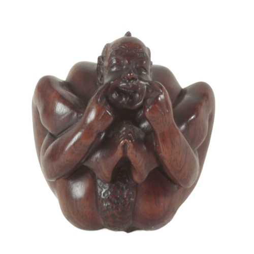 89 - A GROUP OF THREE JAPANESE CARVED WOOD NETSUKE including a late 19th century example, modelled as a w... 