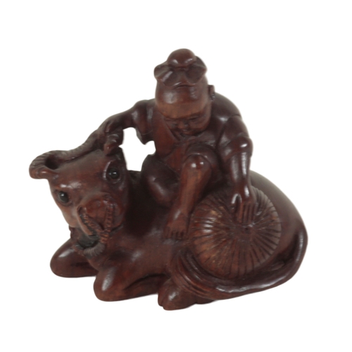 89 - A GROUP OF THREE JAPANESE CARVED WOOD NETSUKE including a late 19th century example, modelled as a w... 