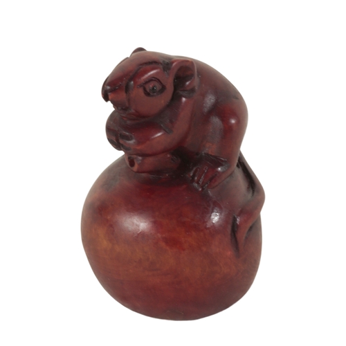 93 - TWO JAPANESE CARVED WOOD NETSUKE one example, in the form of a field mouse atop a nut, 5.5cm high, t... 