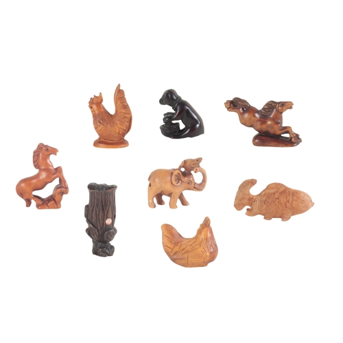 99 - A COLLECTION OF EIGHT NETSUKE partially signed, the tallest, adorned with a frog snake and snail, me... 