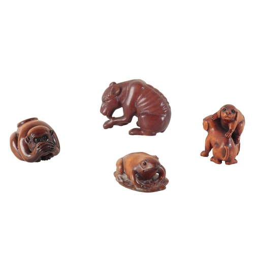 106 - A GROUP OF SIX JAPANESE NETSUKE including a carved wood group of two puppies playing, signed to the ... 