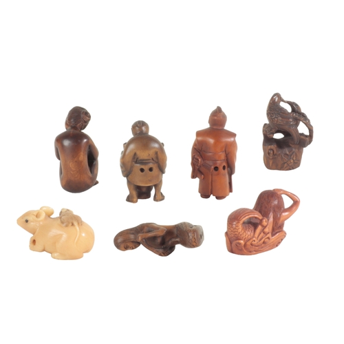 112 - A GROUP OF SEVEN JAPANESE NETSUKE the tallest, figured as a samurai, 6cm high (7)

Provenance: Purch... 