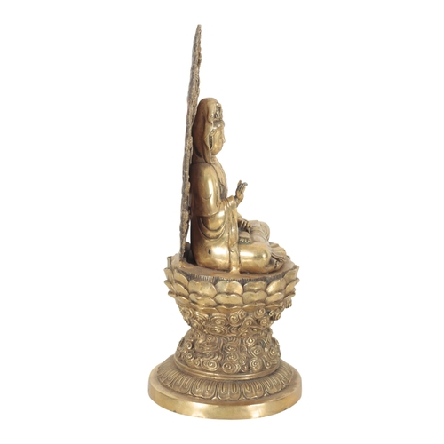 122 - A POLISHED BRONZE FIGURE OF THE BODHISATTVA GUANYIN probably 19th/20th Century Chinese, the circular... 