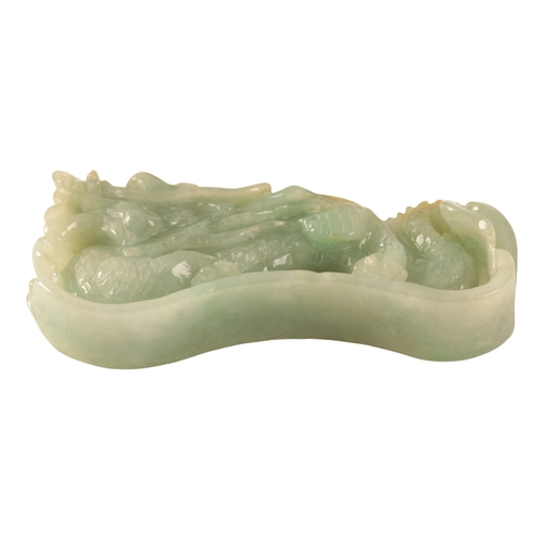 128 - A CHINESE RARE JADE PAPERWEIGHT Qing, 19th century, carved as a dragon with huanghuali wood stand, c... 