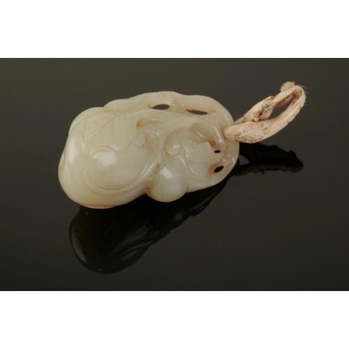 130 - A CHINESE PALE CELADON JADE PENDANT Qing, carved as a gourd with leaves, 6cm long