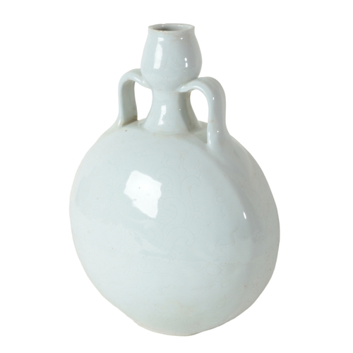 145 - A CHINESE BLANC DE CHINE TWIN HANDLE MOON FLASK Ming or later, with insides decorated depicting drag... 