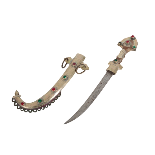 167 - A MOROCCAN JAMBIYA 20th Century, the 23.5cm steel blade with brass overlaid wooden handle inset with... 