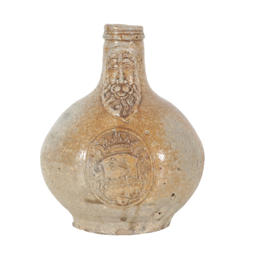 172 - A 17TH CENTURY PALE BROWN STONEWARE BELLARMINE FLAGON with exaggerated face mask and unusually with ... 